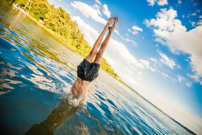 Man in handstand in water