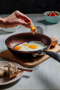 Fried egg. view of two fried eggs on a frying pan. ready to eat with breakfast or lunch