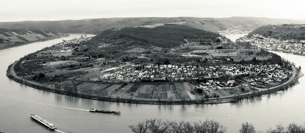 High angle view of river by city against sky