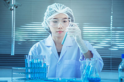 Scientist working at table in laboratory