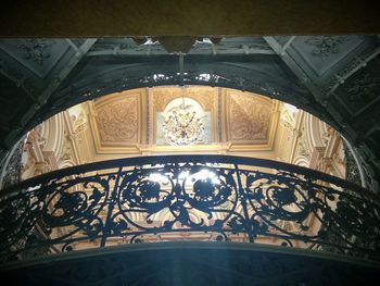 Low angle view of illuminated chandelier in building