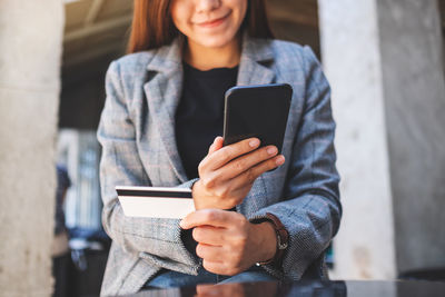 Young woman using mobile phone