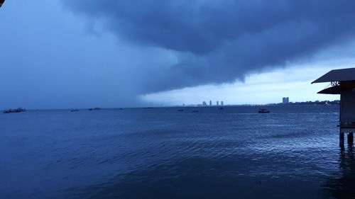 Scenic view of sea against sky at dusk