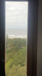 Scenic view of sea seen through window