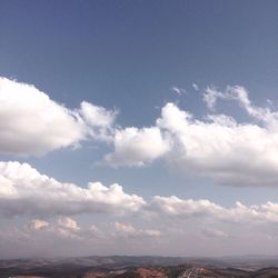 Scenic view of clouds over mountains