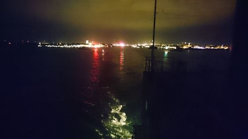 Reflection of illuminated buildings in water