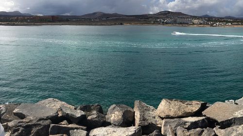 Scenic view of sea against blue sky