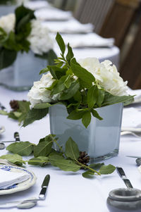 Close-up of white roses on table