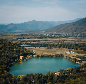 Scenic view of lake and mountains against sky