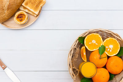 High angle view of orange fruits on table