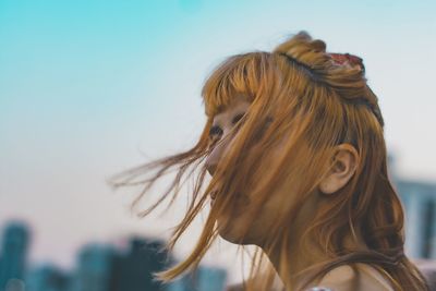 Portrait of woman against sky