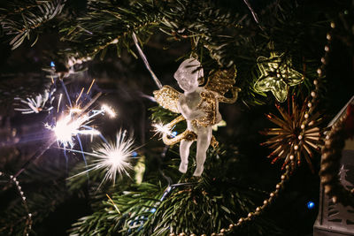 Close-up of illuminated christmas tree at night