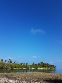 Scenic view of land against blue sky