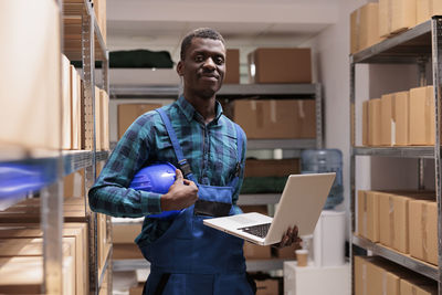 Portrait of young man using digital tablet