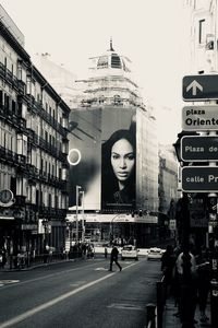 City street and buildings against sky