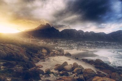 Scenic view of mountains against cloudy sky