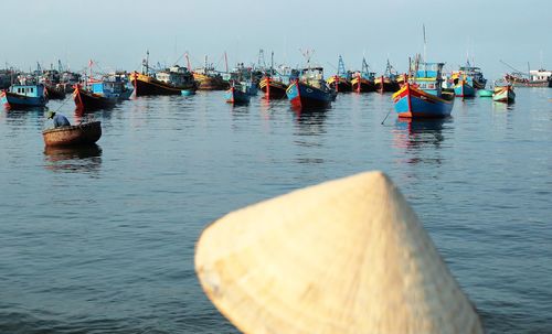 Boats moored in sea