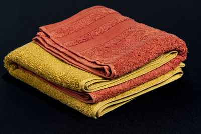 High angle view of sofa on table against black background