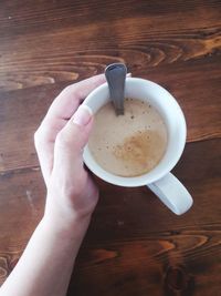 High angle view of coffee cup on table