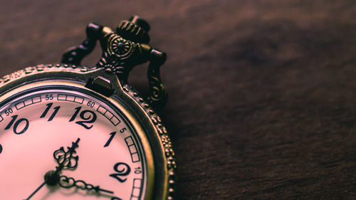 Close-up of clock on table