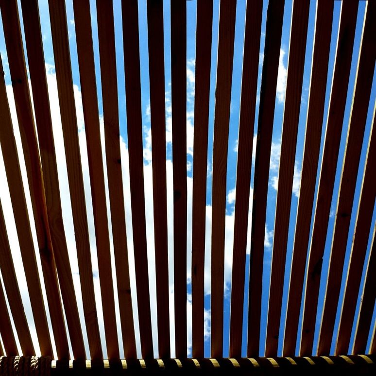 pattern, full frame, backgrounds, design, striped, low angle view, repetition, no people, in a row, abstract, outdoors, textured, blue, shadow, day, sunlight, sky, nature, tree, protection