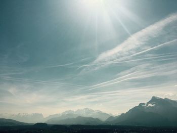 Low angle view of snowcapped mountains against sky