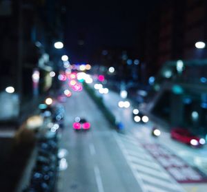 Defocused image of illuminated street at night