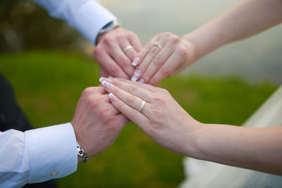 Close-up of couple holding hands