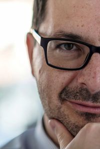 Close-up portrait of man wearing eyeglasses