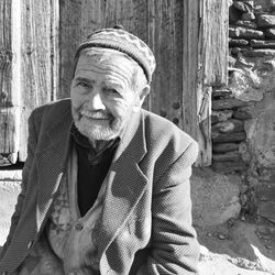 Portrait of man sitting in park