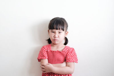 Portrait of a smiling girl over white background