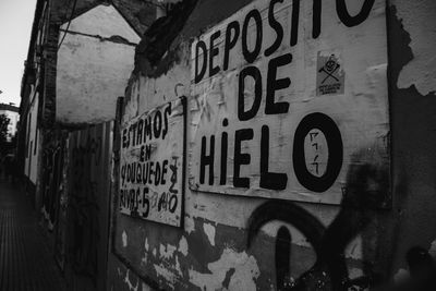 Close-up of text on brick wall