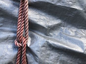 Close-up of rope tied on metal