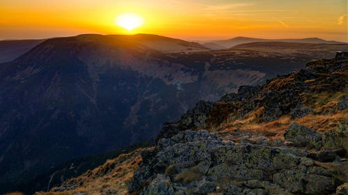 Scenic view of mountains against sky during sunset