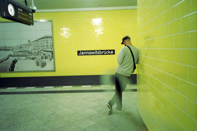 Full length of man standing at subway station