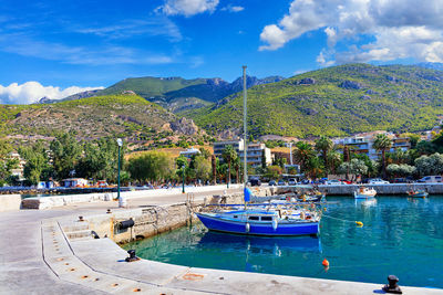 Scenic view of the bay and pier loutraki, greece, where small fishing schooners, yachts, boats.