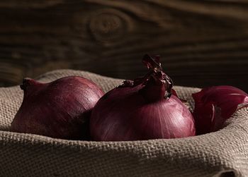 Close-up of onions in basket on table