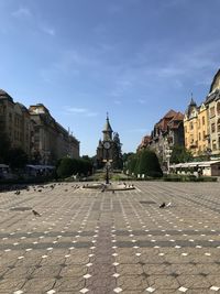 View of buildings in town against sky