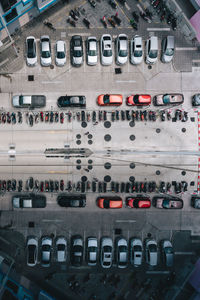 Directly above shot of cars and motorcycles in parking lot