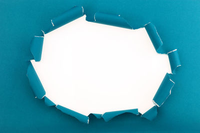 High angle view of empty paper against blue background