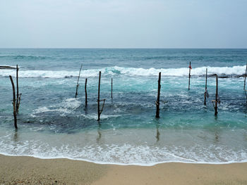 Scenic view of beach and sea against sky