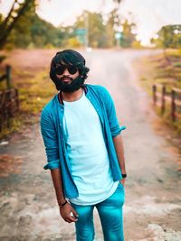 Full length of young man standing outdoors