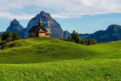 View of an old wooden church in the swiss mountains on lake lucerne.