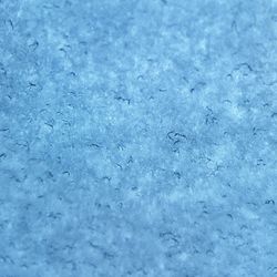 Full frame shot of snow on blue surface