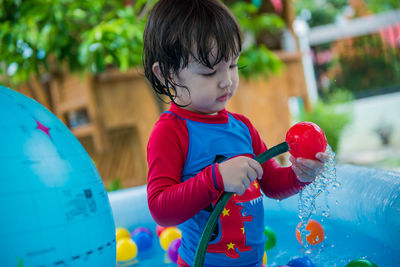 Cute boy playing with toy