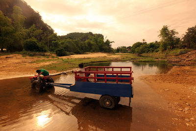 Man by tractor in stream