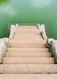High angle view of staircase by sea