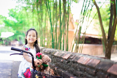 Portrait of a smiling girl standing outdoors