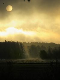 Scenic view of landscape against sky during sunset