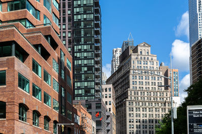 Low angle view of buildings in city against sky